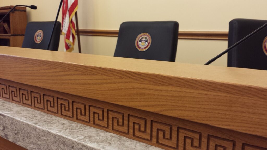 Photo of a committee room dais in the Colorado State Capitol building.